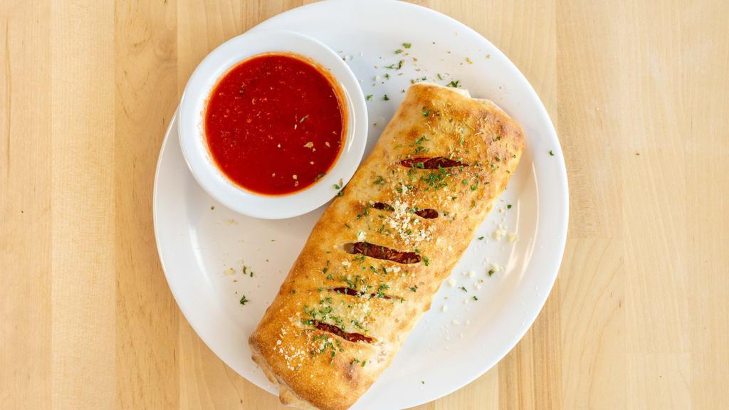 Stromboli · Pepperoni, sliced Italian sausage, Canadian bacon, and mozzarella. Served with two ranches or two marinara.