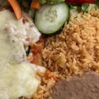 Chile Relleno · Poblano pepper stuffed with cheese or beef. Served with rice, beans, and guacamole.