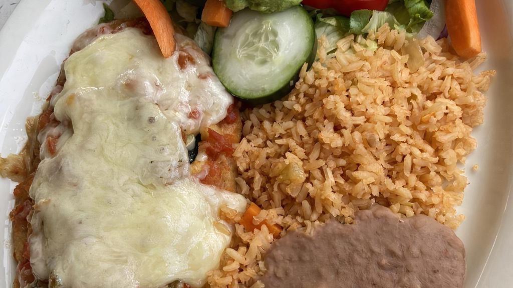 Chile Relleno · Poblano pepper stuffed with cheese or beef. Served with rice, beans, and guacamole.