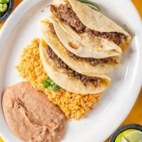Barbacoa Taco Plate (3) · Three barbacoa tacos. Served with rice and beans. Garnished with diced onions, chopped jalap...