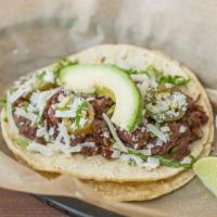 Crossroads · Smoked beef brisket with grilled onions, jalapenos, cilantro, jack cheese & a slice of avoca...