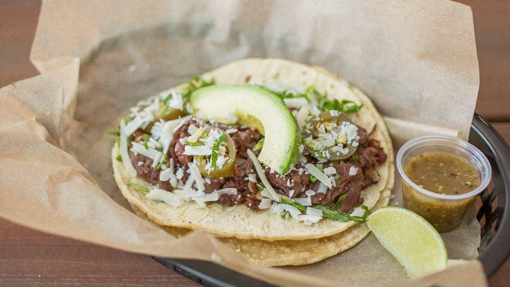 Crossroads · Smoked beef brisket with grilled onions, jalapenos, cilantro, jack cheese & a slice of avocado.  Served with TOMATILLO SAUCE on a fresh corn tortilla. Dairy, Soy, Avocado.
