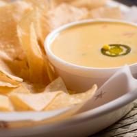 Chips & Queso - Regular · Our famous Queso made daily from a recipe handed down from our illustrious founders.