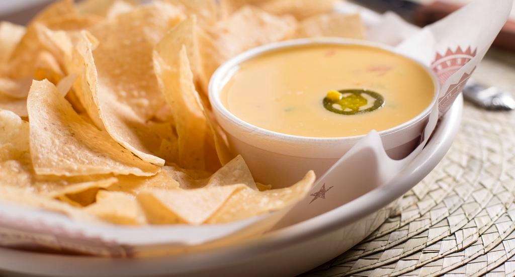 Chips & Queso · Crispy tortilla chips & our Famous Texadelphia Queso!