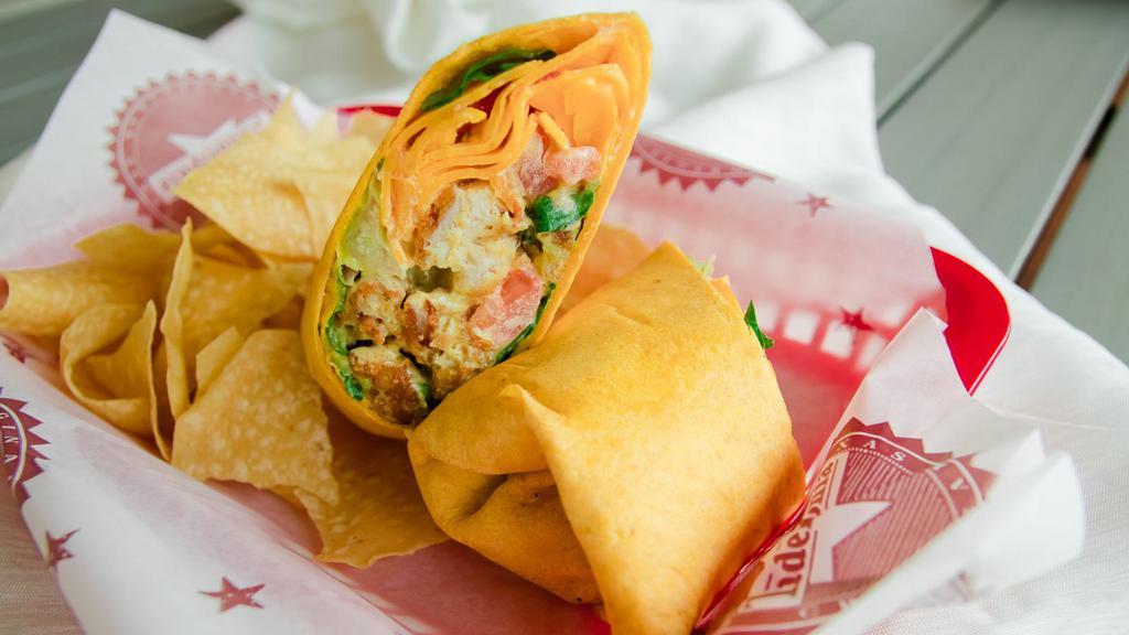 Crispy Chicken Wrap · Crispy chicken strips on a Southwest wrap with guacamole, lettuce, tomato, shredded mixed cheeses & our famous Mustard Blend.