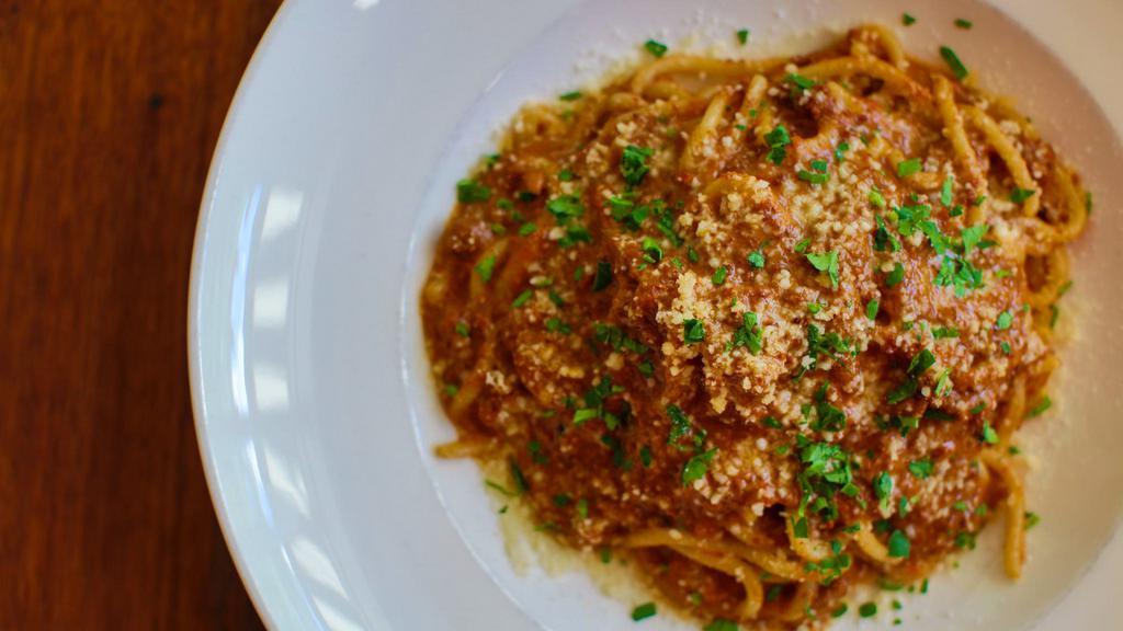 Spaghetti Bolognese · Spaghetti with meat sauce, parmesan, and pecorino.