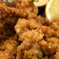 Calamari (Hand Breaded Per Order) · Served with your choice of our housemade marinara sauce or our housemade spicy remoulade sau...