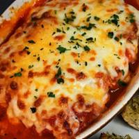 Lasagna Al Forno · Traditional with ground beef, ricotta, Parmesan, and mozzarella baked in our housemade marin...