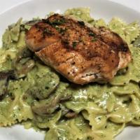 Salmon Pesto Pasta · Bowtie pasta and sautéed mushrooms tossed in our housemade pesto sauce and topped with grill...