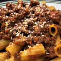 Rigatoni Alla Bolognese · Our housemade bolognese sauce: slow cooked and simmered minced beef in an Italian soffritto ...