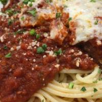 Eggplant Parmesan (Hand Breaded Per Order) · Layered with ricotta, mozzarella, and marinara and topped with Parmesan cheese, served with ...