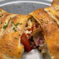 Meaty Calzone · Pepperoni, Spicy Italian Sausage, Sliced Ham, Ground Beef  – w/ a touch of Red Sauce