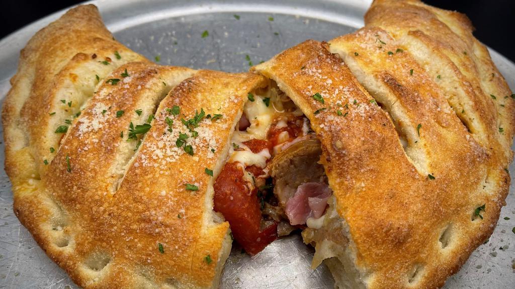 Meaty Calzone · Pepperoni, Spicy Italian Sausage, Sliced Ham, Ground Beef  – w/ a touch of Red Sauce