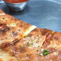 Cheese Calzone (Add Your Toppings) · Ricotta & Mozzarella w/ a touch of Red Sauce