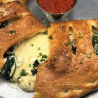 Spinach & Feta Calzone · Spinach w/ Feta & Mozzarella Cheeses 
with a touch of Ricotta and our House White Sauce