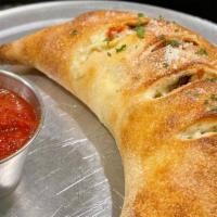 Sausage And Pepper Calzone  · Spicy Italian Sausage and sautéed bell peppers and onions w/ a touch of Red Sauce