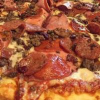 Meaty Pie · Pepperoni, Shaved Ham, 
Ground Beef, & Spicy Italian Sausage