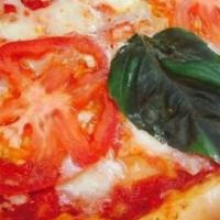 Margherita · Fresh mozzarella, fresh basil leaf, sliced roma tomatoes on our housemade red sauce.
