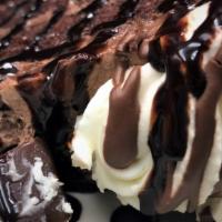 Chocolate Mousse Cake · Rich Chocolate Cake & fluffy Mousse - covered in a Chocolate Buttercream icing and topped w/...