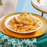 Za'Atar Fries · Fresh cut french fries topped with za'atar and feta.