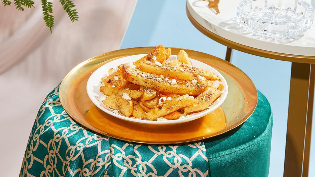 Za'Atar Fries · Fresh cut french fries topped with za'atar and feta.