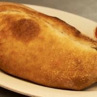 Stromboli · Oven baked rolled pizza dough stuffed with italian sausage, onions, pepperoni, mushrooms, ha...