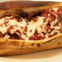 Eggplant Parmigiana Hero · Fried eggplant slices smothered in our marinara sauce & mozzarella cheese, baked in the bric...