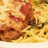 Chicken Parmigiana Dinner · Lightly fried parmesan chicken breasts are smothered with our homemade marinara sauce and ch...