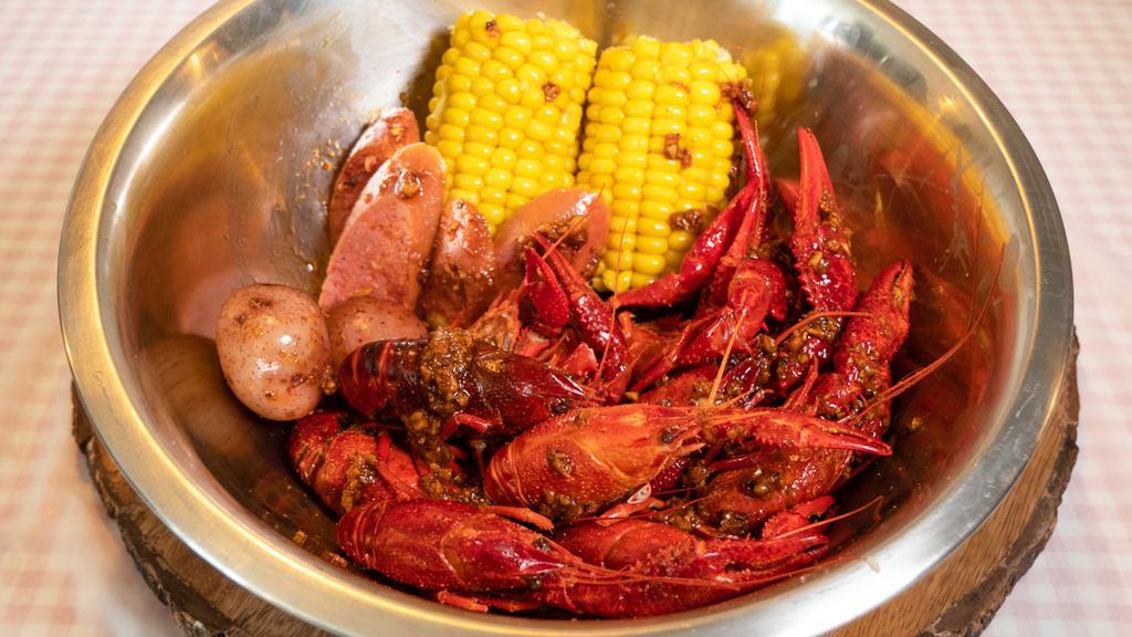 Crawfish Combo · 1lb Crawfish, 1/2lb Sausage, Red Potatoes and Two Corn on the Cob. 
ALL OUR BOILS COME WITH OUR CAJUN HOME SAUCE