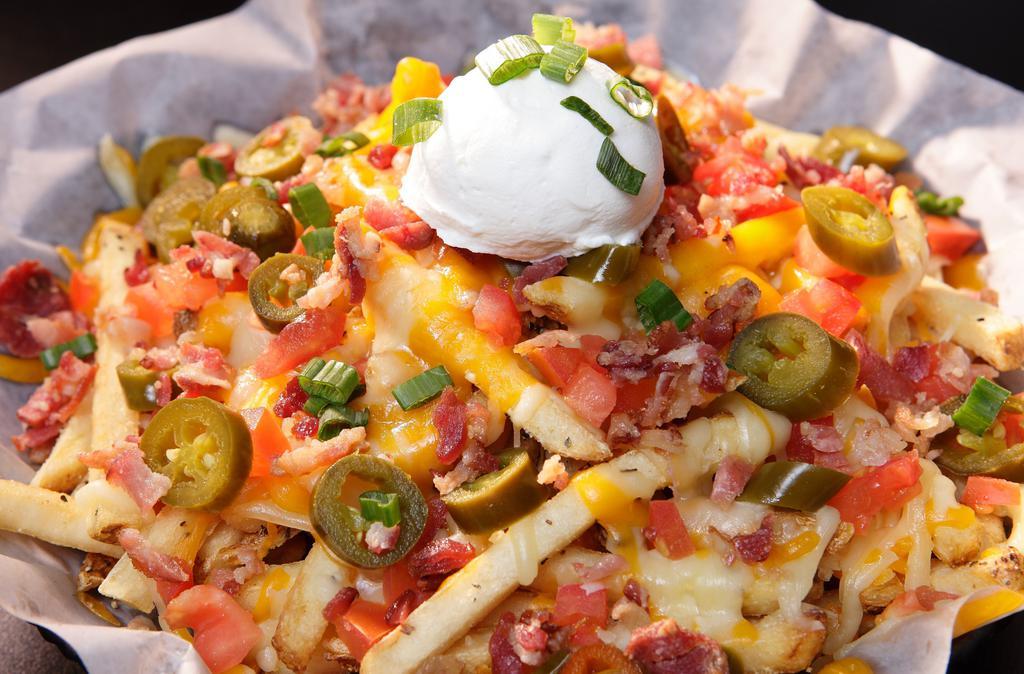 Funky Fries · French fries at their finest! Fresh crisp fries smothered in a culmination of shredded jack and cheddar cheese perfected with a mountain of mouthwatering toppings. Toppings include: jalapeños, sliced green onion, diced tomatoes, bacon bits, and a scoop of sour cream.