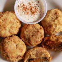 Stuffed Shrooms · Savory mushroom caps stuffed with our famous shrimp and crab stuffing and fried to perfectio...