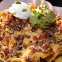 Sauce House Nachos · World's best!! We start with homemade chips, smother them in our chile con queso, jalapeños,...