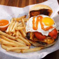 Rise And Shine Burger · Wake up those taste buds! We top our 1/2 pound beef patty with American cheese, hash browns,...