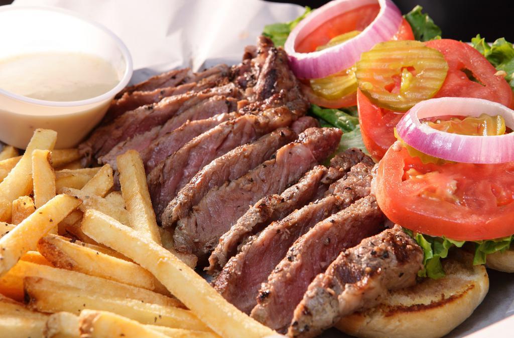 Rib-Eye Steak Sandwich · The steak sandwich of your dreams! Bite into our juicy rib-eye prepared to your specs. Served with our dijon horseradish sauce.

Consuming raw or undercooked meat, poultry, seafood, shellfish, or eggs may increase the risk of foodborne illness.