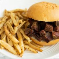 Brisket Sandwich · It’s not complicated. Tender and juicy beef brisket, BBQ sauce over top. Our three BBQ choic...