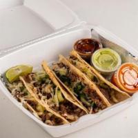 Caramelo Chorizo · Chorizo tacos with a fine thin flour taco tortilla. Filled with cheese and carne asada. On t...