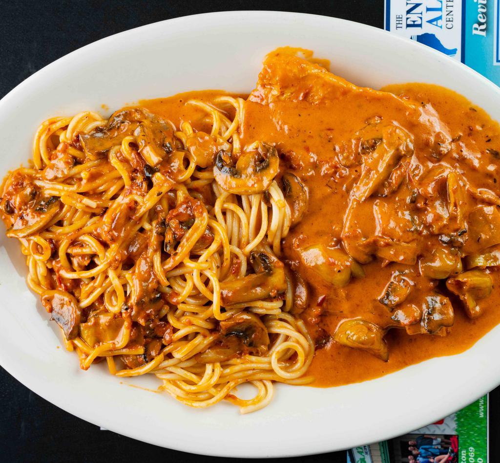 Chicken Cappuccino Entrée · Boneless breast of chicken sautéed with fresh mushrooms and pepperoncini peppers in a cream sauce with a touch of red sauce served with spaghetti.