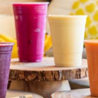 Pitaya Smoothie · Passion fruit juice, coconut milk, pitaya, mangos, bananas, and pineapples.