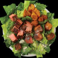 Classic Caesar Bowl · House Croutons, Parmesan, Romaine. Recommended dressing is Caesar Dressing. Shown with Steak.
