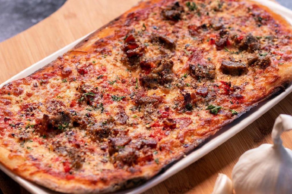 The Italian · house made all-beef meatballs · pepperoni · bacon · mozzarella · Parmesan · parsley · crushed red pepper · oregano · fire roasted red peppers