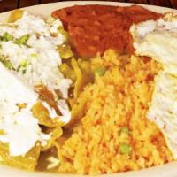 Chilaquiles With Beef · Served with rice and beans. Cheese and sour cream on top.
