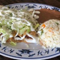 Flautas · Three rolled-up corn tortillas filled with chicken. Served with rice, refried beans, fresco ...