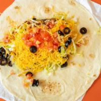 Super Burrito · A steamed flour tortilla filled with refried beans, 100% ground beef, mild red sauce, real s...