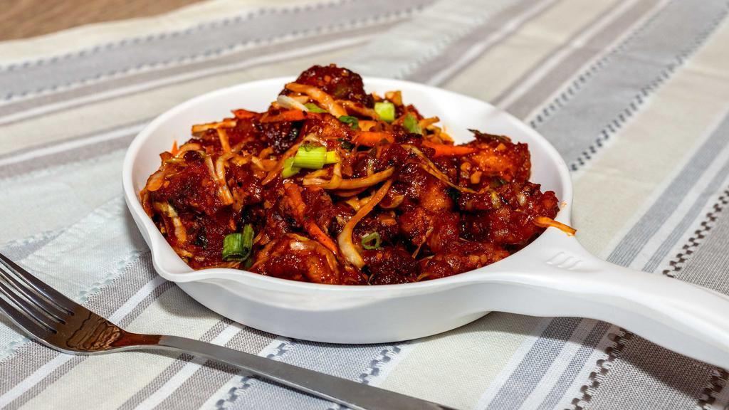 Gobi Manchurian Dry · Batter fried cauliflower, stir-fried with Indo-Chinese spices.