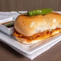 Vada Pav (2Pc) · The original Indian burger, made with a spiced potato dumpling, spicy garlic chutney, and Am...