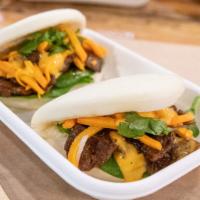 Steamed Buns · Mantou, a cloud-like pillow of steamed bread dough, ready to be filled with firecracker sauc...