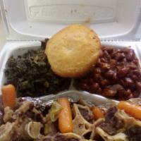Oxtails · Oxtails slowly cooked with carrots comes with cornbread and a side of your choice