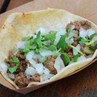 #1 Picadillo · Spicy ground beef and potatoes, diced onion, cilantro.