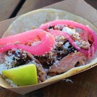 #2 Roasted Pork · Smoked green chile pork, cotija cheese, pickled red onions.