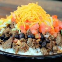 #13 Texican Bowl · Topped with Tex-Mex beef, lettuce, tomato, cheese.